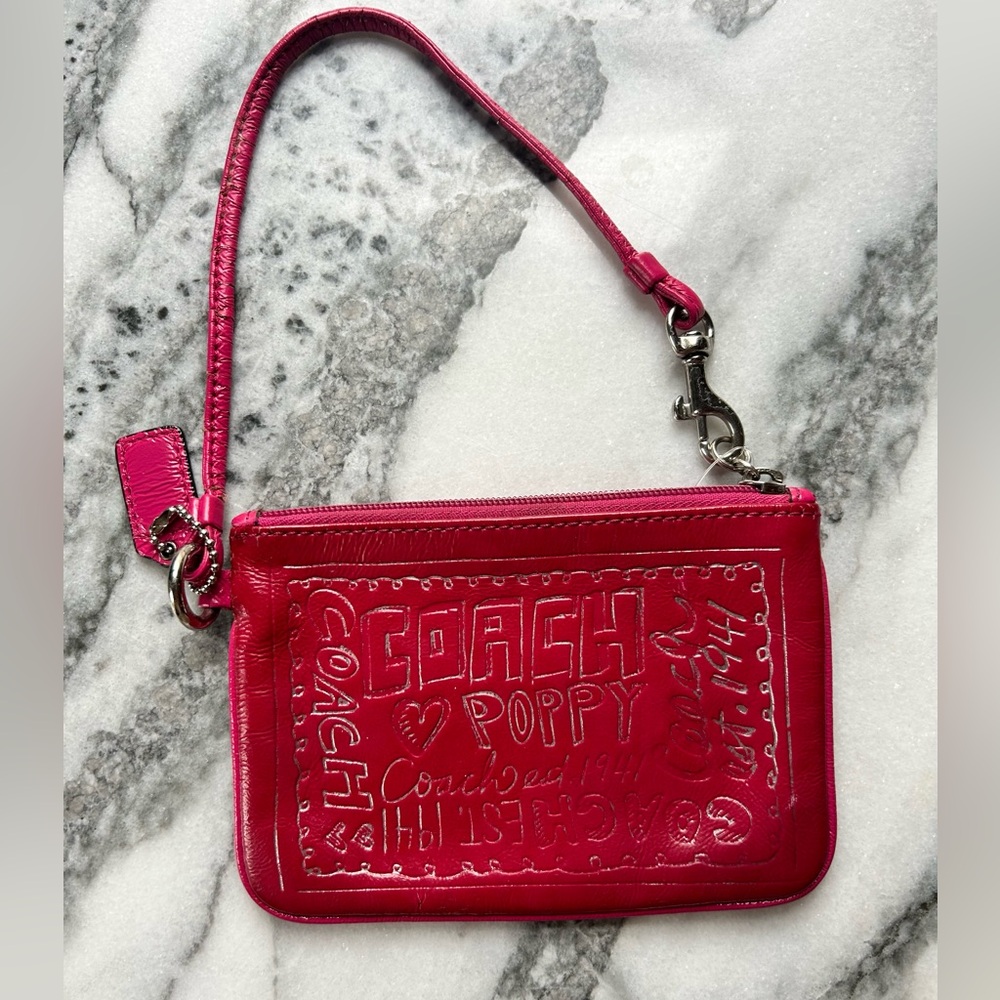 Authentic pink Coach women's patent leather wristlet from Coach Poppy collection